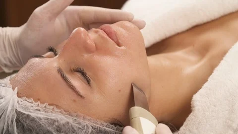 Close-up view of a female client having ultrasonic deep facial peeling Stock Footage 121321379