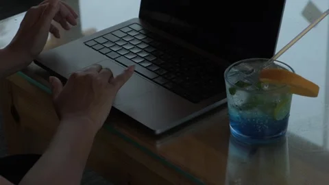 Close view of female freelancer working on laptop with notebook, phone and drink 스톡 동영상 346251445
