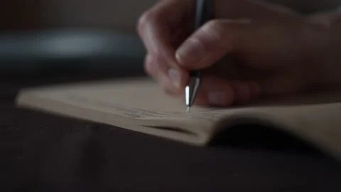 Close-up view of female hand making notes in sketchbook. Education, To do list Stock-Footage 152584384