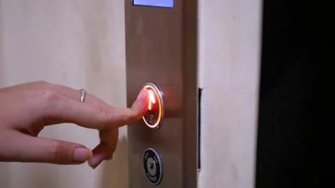 Close up view of Female Hand Pushing Elevator Button in Office or Hotel. Yo.. Stock Footage 281577141