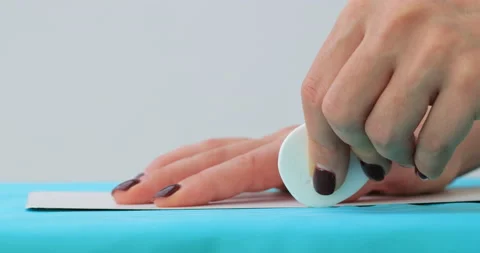 Close view of female hands draws on cloth with sewing pattern and chalk. Dres Stock Footage 150440811