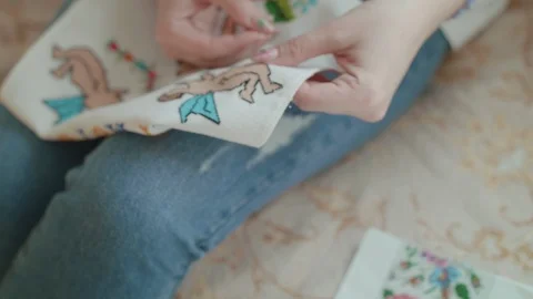 Close view of female hands embroiders the Easter towel. 4K 스톡 동영상 117930730