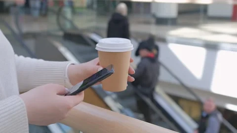 Close-up view of female hands holding smartphone, using the touchscreen Stock Footage 244590873