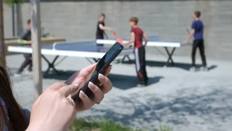 Close-up view of female hands holding smartphone, using the touchscreen Stock Footage 246731899