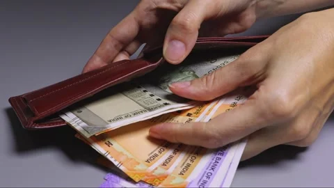 Close-up view of female hands holding wallet full of Indian rupee notes. Stock Footage 303508613
