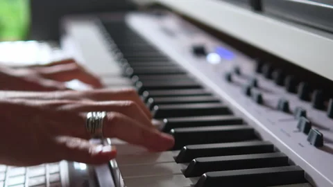 Close up view of female hands playing electric piano Stock Footage 231245184