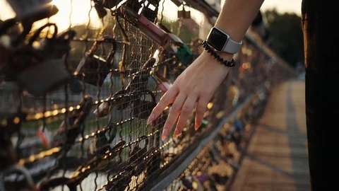 Close up view female hands with smart watch on the bridge with the locks display Stock Footage 95448667