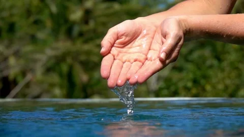 Close-up view of female hands touching water refreshing stream. earth, Pure Stock Footage 270407979