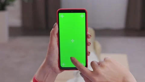 Close up view of female hands using smartphone with green mock-up screen Stock Footage 197140600