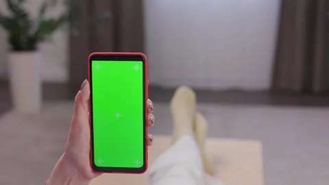 Close up view of female hands using smartphone with green mock-up screen Stock Footage 246492322