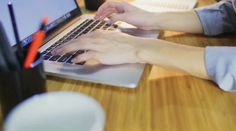 Close-up view of female hands writing on laptop. Stock Footage 60032401