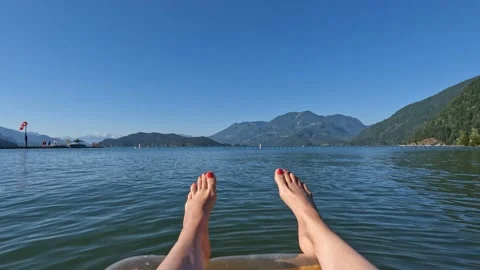 Close up view of a female legs hanging down from a lilo Stock Footage 201751987