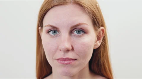 Close-up view of a female with long red hair and light skin facing the camera in Stock-Footage 331544882