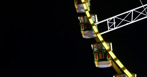 Close up view Ferris wheel, reduce speed and stop on night sky. Stock Footage 113488403
