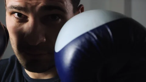Close up view of fighter with fists in boxer gloves Video stock 129153175