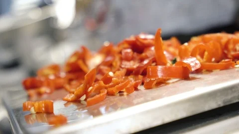Close up view of finely chopped red pepper. Male hand holding handful of pepper Stock Footage 105272013