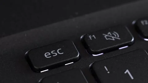 Close up view of finger pressing laptop ESC button, notebook keyboard. Stock Footage 291883461