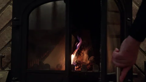 Close up view fireplace in which dry logs burn heats house and creates coziness Stock Footage 293677489