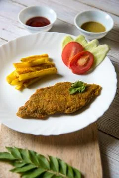 Close up view of fish and chips with salad Stock Photos