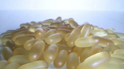 Close-up view of fish oil omega 3 liquid gel capsules Stock Footage 166106554