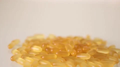 Close-up view of fish oil omega 3 liquid gel capsules Stock Footage 166403969