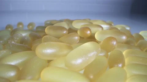 Close-up view of fish oil omega 3 liquid gel capsules Stock Footage 166404072