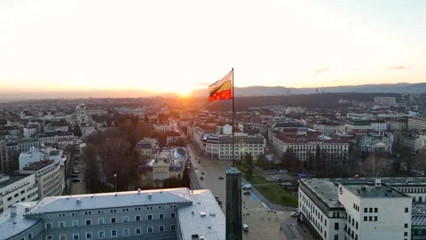 A close-up view of the flag of Bulgaria blowing in the wind against a sunset Stock Footage 300213411