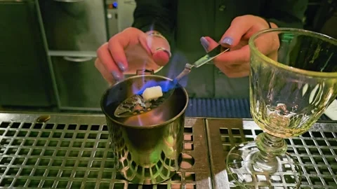 Close view of flaming drink preparation, showing bartender hands, blue fire Stock Footage 339847691
