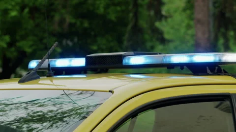 Close up view of a flashing blue emergency light bar mounted on a vehicle Stock Footage 337148796