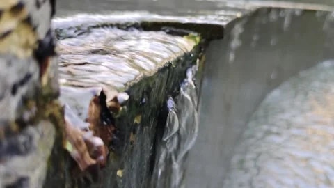 Close-Up View of Flowing Water Over Edge of Natural Structure Stock Footage 308342222