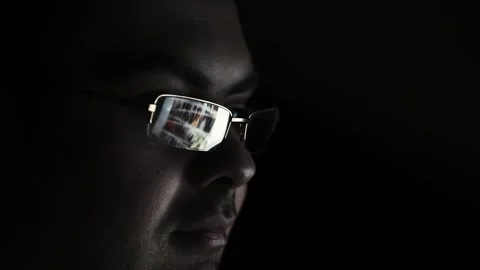 Close up view of focused businessman wears computer glasses for reducing eye Stock Footage 252853726