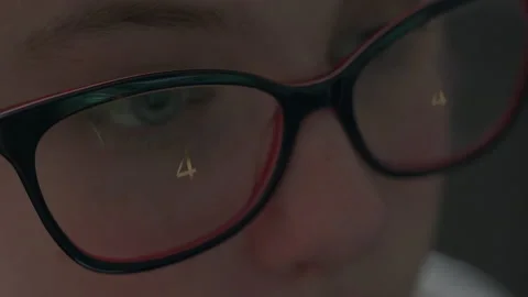 Close up view of focused woman's face wears glasses  looking at pc screen Video stock 167422283