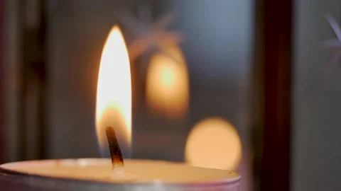 Close up view footage of igniting a candle in the dark, candle position on the Stock Footage 144032660