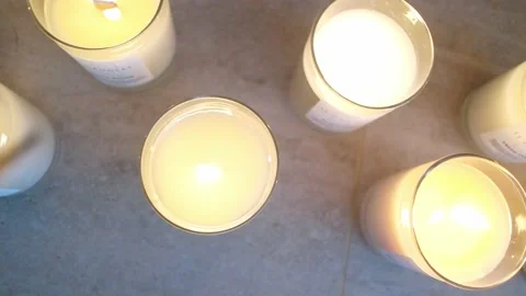 Close up view footage of igniting a candle on the light background. Media. Cozy 動画素材 167157650