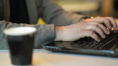 Close Up View of Freelancer Working on Laptop Siting In Internet Cafe Indoors Stock Footage 106288961