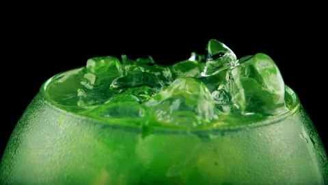 Close-up view of fresh mojito ice cocktail with lime on black background Stock Footage 75626777