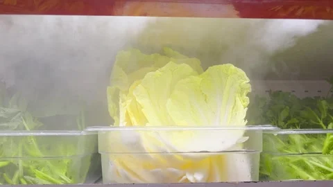 Close view of fresh napa cabbage in a refrigerated food display, healthy ea.. Stock Footage 338133210