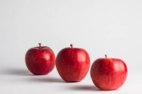 Close-up view of fresh red apples on a white background Stock Photos