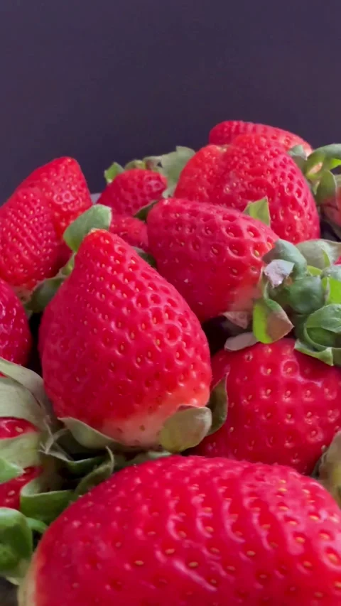 Close up view of fresh red strawberries rotating slowly Video stock 331980764