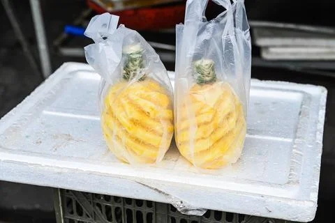 A close up view of fresh sweet pineapple fruits beautifully peeled in a spi.. Stock Photos
