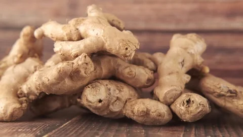 Close up view of fresh whole ginger root on a dark wooden table background,.. Stock Footage 333029553