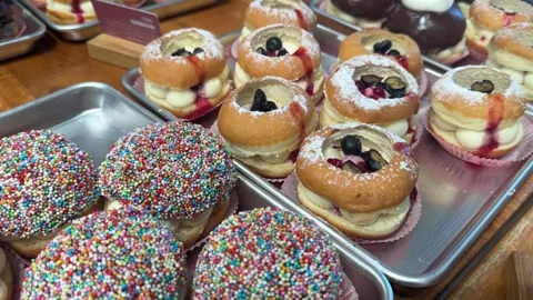 Close-up view of freshly made sufganiyot Stock Footage 295442897
