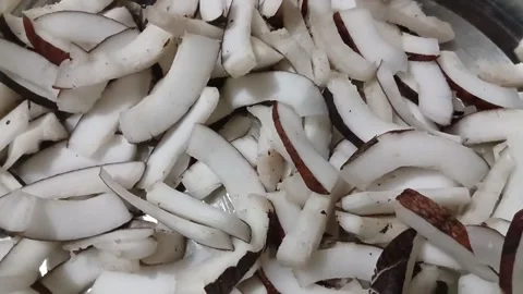 Close up view of freshly sliced raw coconut meat pieces. Stock Footage 338266961