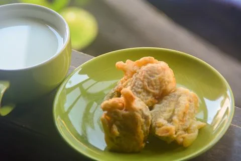 Close up view of fried bananas and hot coffee. fried bananas accompanied by.. Stock Photos