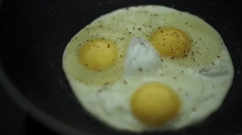 Close up view of the fried egg on a frying pan Stock Footage 56260325