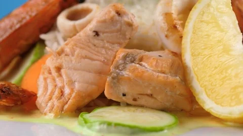 Close-up view of fried Shrimps, salmon and squid with rice Stock Footage 78669341