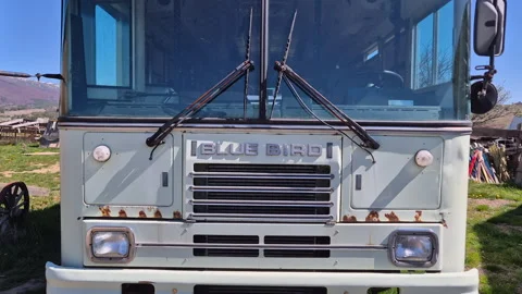 Close-up view of the front and windshield of Blue Bird bus of M.S.D.O.J. Stock Footage 334795767