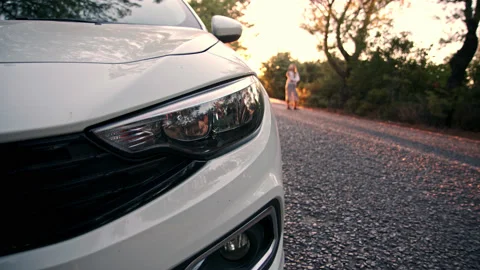 Close up view of front light of car headlights. unrecognizable white car is Stock Footage 222309972