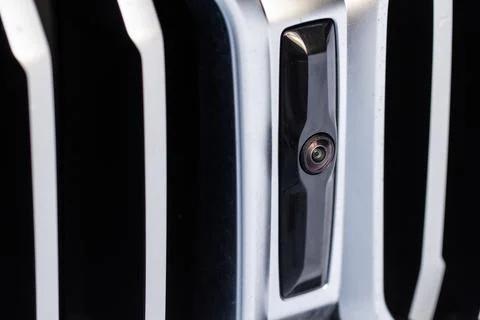 Close up view of front parking assist video camera on the car. Front view cam Stock Photos