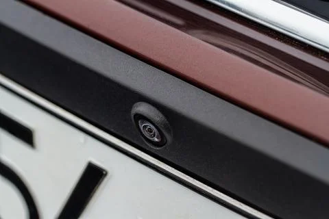 Close up view of front parking assist video camera on the car. Front view cam Stock Photos